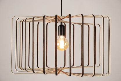 LUWALD NO.01 Pendelleuchte aus Holz, schwarz, handgefertigt, zylinderförmig, angeschaltet, Seitenansicht